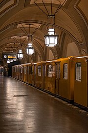 Yellow U-Bahn train in underground station