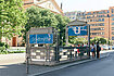 Students outside blue U-Bahn Stadtmitte station entry on a sunny day at Gendarmenmarkt