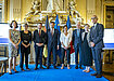 From left: Cornelia Woll, Sylvie Retailleau, Clement Beaune, Tarik Abou-Chadi, Emmanuel Gallet, Hans Dieter Lucas, Kate Vivian and Jean Pisani-Ferry stand on a stage in a brilliant gilded hall for the Henrik Enderlein Prize Award Ceremony. Not pictured: Stefanie Stantcheva, who accepted the award remotely via video call.