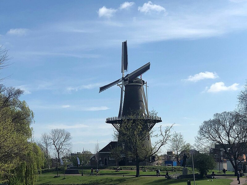 A windmill beside a canal in Leiden.